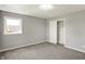 Bright bedroom features neutral walls and carpet, a closet, and a window for natural light at 5354 Brendon Park Dr, Indianapolis, IN 46226