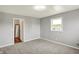 Bedroom features neutral walls and carpet and an open door to another room at 5354 Brendon Park Dr, Indianapolis, IN 46226