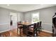 An open dining room offers natural light, hardwood floors, and neutral paint perfect for entertaining at 5354 Brendon Park Dr, Indianapolis, IN 46226