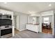 This kitchen features stainless steel appliances, a live edge countertop island, and opens to the dining area at 5354 Brendon Park Dr, Indianapolis, IN 46226