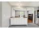 This kitchen island features a live edge countertop, adding warmth and character to this inviting space at 5354 Brendon Park Dr, Indianapolis, IN 46226