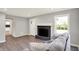 Cozy living room with fireplace, grey flooring, and natural light at 5354 Brendon Park Dr, Indianapolis, IN 46226