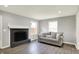 Bright living room featuring a fireplace, light grey walls and modern decor at 5354 Brendon Park Dr, Indianapolis, IN 46226