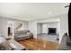 Spacious living room featuring vinyl and hardwood floors, comfortable seating, and abundant natural light at 5354 Brendon Park Dr, Indianapolis, IN 46226