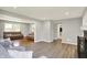 Spacious living room featuring grey walls and transition to hardwood flooring at 5354 Brendon Park Dr, Indianapolis, IN 46226