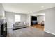 Open-concept living room featuring a cozy fireplace and grey flooring at 5354 Brendon Park Dr, Indianapolis, IN 46226