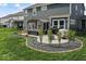 An inviting backyard patio features a pergola with cozy seating and a built-in grill, perfect for outdoor entertaining at 5363 Citadel Dr, Noblesville, IN 46062