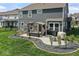 An inviting backyard patio features a pergola with cozy seating and a built-in grill, perfect for outdoor entertaining at 5363 Citadel Dr, Noblesville, IN 46062