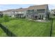 Spacious backyard with manicured lawn, fence, patio, grill, and outdoor furniture, ideal for relaxation and entertaining at 5363 Citadel Dr, Noblesville, IN 46062