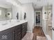 Bathroom featuring double sink vanity, a walk-in closet, and tiled walk-in shower at 5363 Citadel Dr, Noblesville, IN 46062