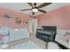 This bedroom has pink walls, carpeted floors, shelving and a small window to let the sunshine in at 5363 Citadel Dr, Noblesville, IN 46062