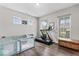 Versatile flex space with laminate flooring, natural light, and exercise equipment at 5363 Citadel Dr, Noblesville, IN 46062