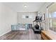 Versatile flex space with laminate flooring, natural light, and exercise equipment at 5363 Citadel Dr, Noblesville, IN 46062