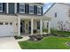 Charming front porch with rocking chairs and manicured landscaping at 5363 Citadel Dr, Noblesville, IN 46062