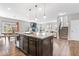 Bright kitchen with granite counters, a center island, stainless appliances, and open floor plan at 5363 Citadel Dr, Noblesville, IN 46062