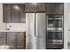 The kitchen features stainless steel appliances, granite countertops, and dark wood cabinets at 5363 Citadel Dr, Noblesville, IN 46062
