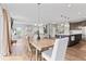 Open concept living area, dining area, kitchen with hardwood floors, and staircase at 5363 Citadel Dr, Noblesville, IN 46062