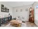 Bright living room featuring wood floors, neutral paint, sofa, and grandfather clock at 5363 Citadel Dr, Noblesville, IN 46062
