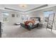 Large carpeted main bedroom with tray ceiling, neutral paint, and lots of natural light at 5363 Citadel Dr, Noblesville, IN 46062