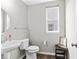 Simple half bath with vanity sink and white toilet at 5363 Citadel Dr, Noblesville, IN 46062