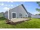 The backyard boasts a patio with a view of the green lawn and fenced perimeter at 5465 Tanglewood Ln, Whitestown, IN 46075
