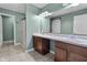Bathroom features a double sink vanity, framed mirror, walk-in shower, and barn door at 5465 Tanglewood Ln, Whitestown, IN 46075