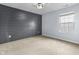 Bedroom featuring a gray shiplap wall, neutral carpet, and natural light at 5465 Tanglewood Ln, Whitestown, IN 46075