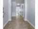 Entry hall with neutral walls, tile flooring, and visible doorway to the living area at 5465 Tanglewood Ln, Whitestown, IN 46075