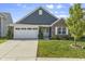 Charming single-Gathering home with a manicured lawn, a two-car garage, and a welcoming front porch at 5465 Tanglewood Ln, Whitestown, IN 46075