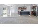 This is a kitchen featuring stainless steel appliances, a center island, and a sliding door that leads to the backyard at 5465 Tanglewood Ln, Whitestown, IN 46075