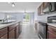 This is a kitchen featuring stainless steel appliances, modern countertops, and access to the backyard at 5465 Tanglewood Ln, Whitestown, IN 46075