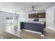 A kitchen featuring an island with seating, modern appliances, and sliding glass doors to the backyard at 5465 Tanglewood Ln, Whitestown, IN 46075