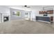 Open concept living area featuring a fireplace, ceiling fan, and seamlessly integrated kitchen at 5465 Tanglewood Ln, Whitestown, IN 46075