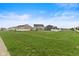 Expansive backyard featuring well-maintained lawn, privacy fence, and surrounding neighborhood homes at 5845 Cresswell Ln, Whitestown, IN 46075