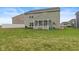 The backyard has a screened-in porch, a grassy yard, and a privacy fence at 5845 Cresswell Ln, Whitestown, IN 46075