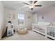 Playful Bedroom featuring twin cribs, a rocket toy, and a ball pit for creative play at 5845 Cresswell Ln, Whitestown, IN 46075