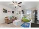 Cozy bedroom with a ceiling fan, comfortable seating and a fun, playful theme at 5845 Cresswell Ln, Whitestown, IN 46075
