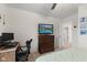 Comfortable bedroom with a desk area and dresser, featuring a large window and neutral carpet at 5845 Cresswell Ln, Whitestown, IN 46075