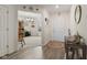 Bright entryway showcasing wood-look floors, neutral walls, and views into an adjacent room at 5845 Cresswell Ln, Whitestown, IN 46075