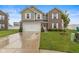 Charming two-story home featuring a manicured lawn, two car garage, and welcoming front porch at 5845 Cresswell Ln, Whitestown, IN 46075