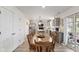 Bright kitchen with table and chairs, white cabinets, stainless appliances, and modern finishes at 5845 Cresswell Ln, Whitestown, IN 46075