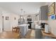 Charming kitchen with stainless steel appliances, gray cabinets, and a functional center island at 5845 Cresswell Ln, Whitestown, IN 46075