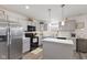 Bright kitchen with stainless steel appliances, subway tile backsplash, and updated gray cabinets at 5845 Cresswell Ln, Whitestown, IN 46075