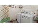 Functional laundry room with washer, dryer, and storage, creating an efficient space at 5845 Cresswell Ln, Whitestown, IN 46075