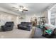 Inviting living room featuring neutral walls, carpeted floors, comfortable seating, and ample space at 5845 Cresswell Ln, Whitestown, IN 46075