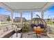 Relaxing screened porch with comfortable seating and scenic outdoor views, perfect for leisure at 5845 Cresswell Ln, Whitestown, IN 46075