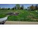 Spacious backyard featuring a fire pit and a black chain-link fence at 6209 Amber Valley Ln, Indianapolis, IN 46237