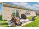 Brick back patio with outdoor chairs, a grill, potted plants, and access to a grassy backyard at 6229 Farlin Dr, Whitestown, IN 46075