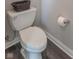 Bathroom featuring a standard toilet with a decorative basket on the tank and a roll of toilet paper at 6229 Farlin Dr, Whitestown, IN 46075
