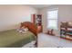 Comfortable bedroom with a window, wooden furniture, and carpeted floors at 6229 Farlin Dr, Whitestown, IN 46075